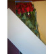 19 червоних троянд у капелюшної коробці